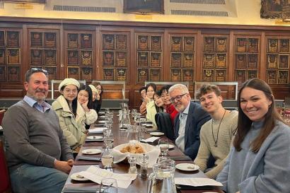 digital marketing students in London dine in a wood-panelled room with lecturers and experts