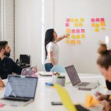 An intern makes a presentation to colleagues at her work experience placement.