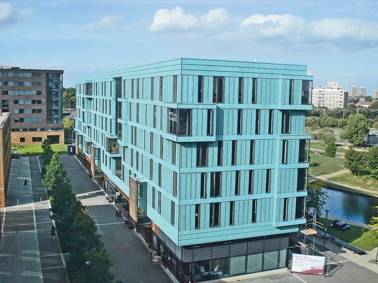 A bright blue building, the France House, sits on the campus of the University of London-Queen Mary.