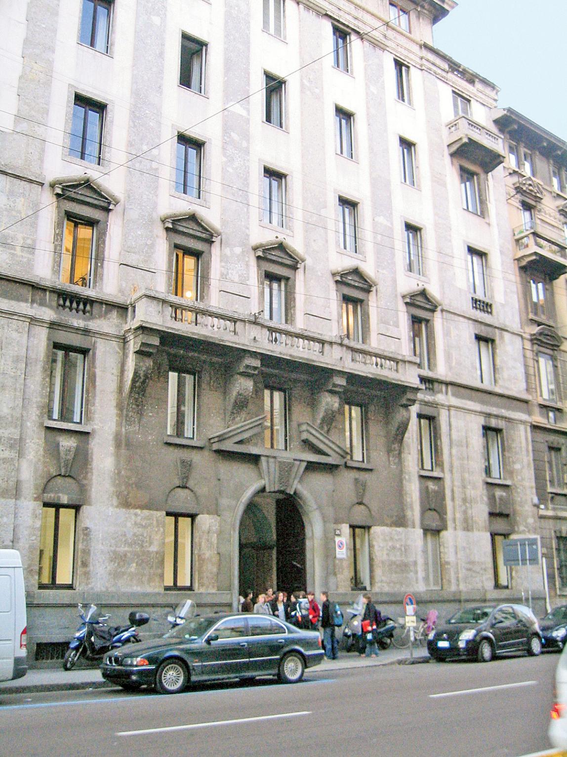 Exterior view of the Milan Center, a grey brick building