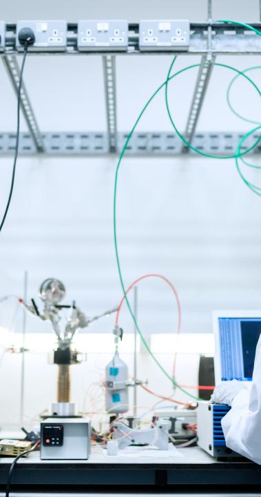 Female engineer in the lab with her back to the camera