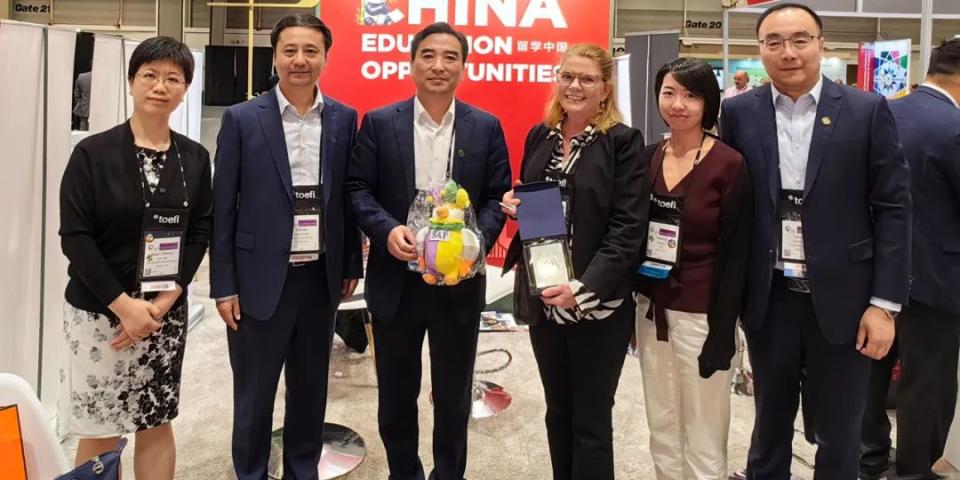 A line of people in suits at NAFSA 2024