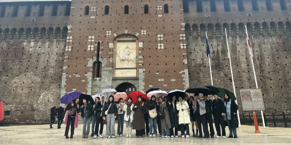 A group of SAF students stand outside Sforzesco Castle in Milan