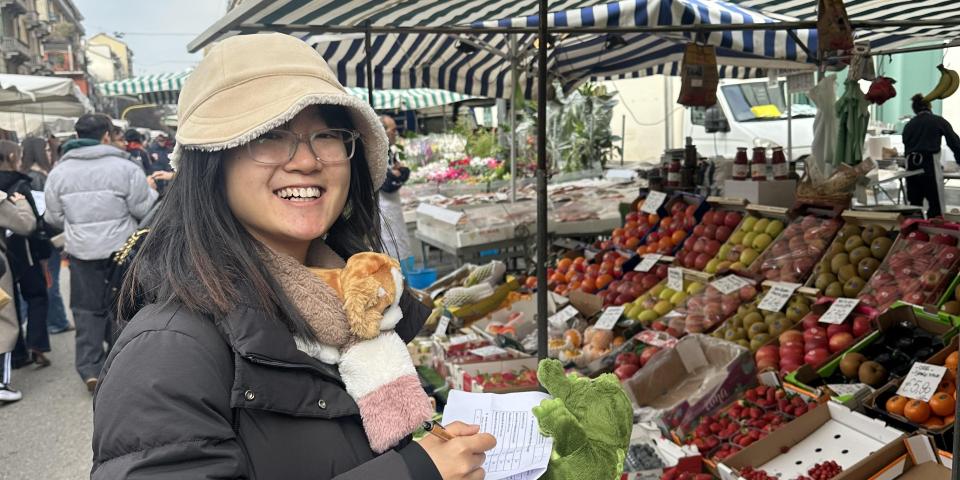 An SAF student takes part in a cultural activity at an open market in Milan